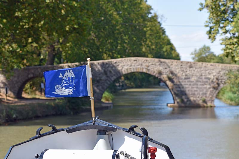 Luxury barge cruise Anjodi cruising beneath a tunnel