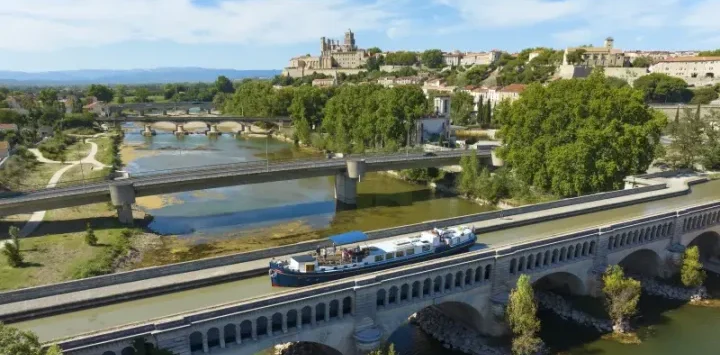 Anjodi crossing the canal aquaduct in August in France.