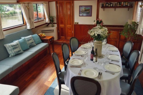 Luxury barge cruise Anjodi cosy dining area