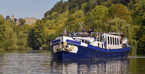 Hotel barge, Magna Carta cruising the River Thames in England