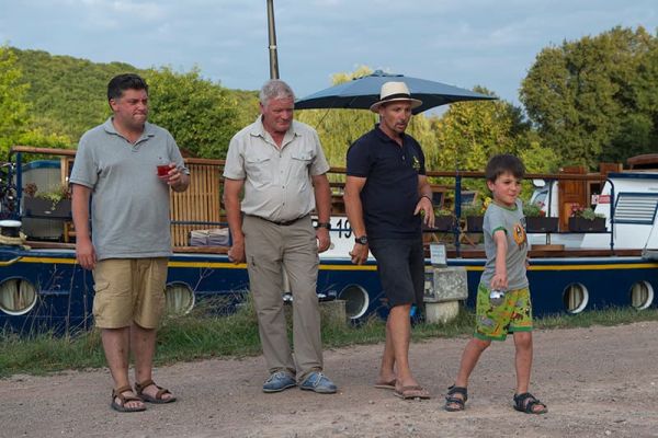 Family playing a game of petanque with the Captain
