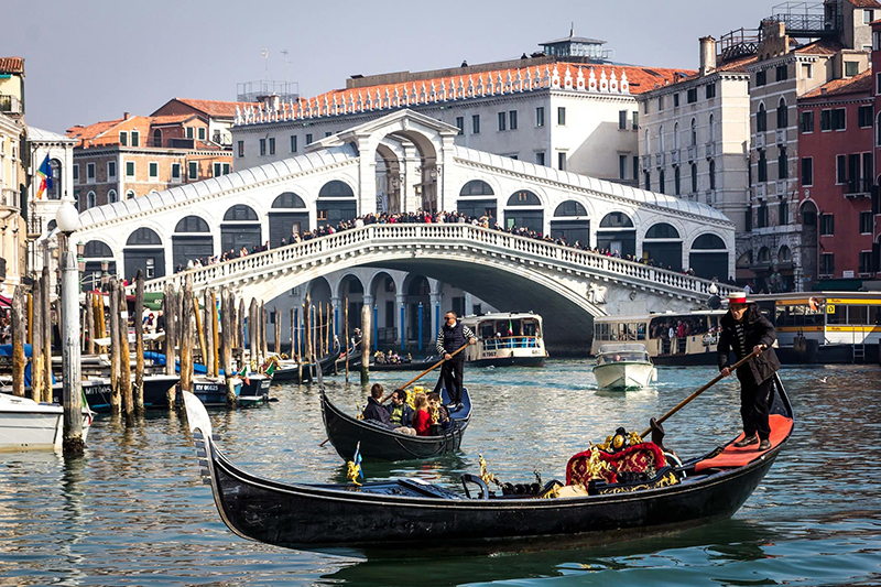 Gondolas below the Rialto Bridge in Venice