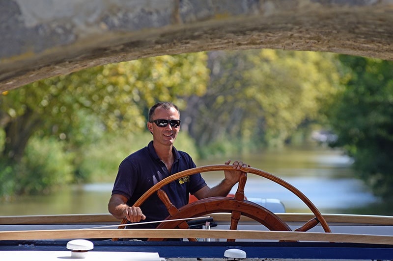 Laurent, the Captain of hotel barge Anjodi