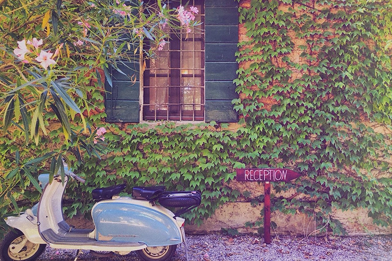 A Vespa parked outside Villa Ca'Zen, a highlight on our La Bella Vita cruise itinerary