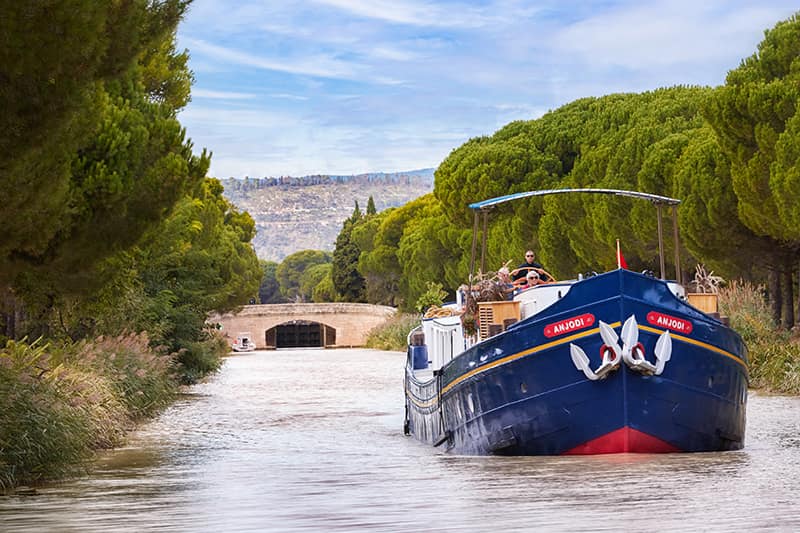 Hotel barge Anjodi cruising the Canal du Midi