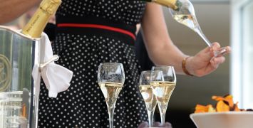 Champagne being poured into a flute glass