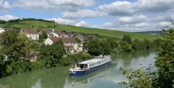 Kir Royale cruising on the River Marne amongst vineyards of Champagne