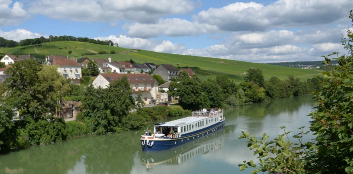 Kir Royale cruising on the River Marne amongst vineyards of Champagne
