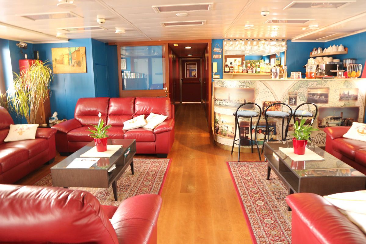 The spacious saloons aboard La Bella Vita, luxury hotel barge cruise