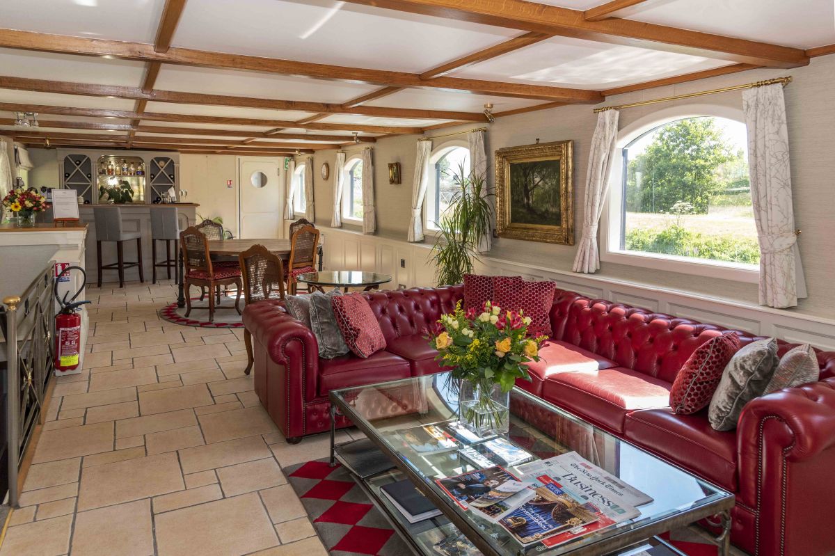 The spacious saloon aboard Renaissance luxury hotel barge, in the Upper Loire and Western Burgundy, France