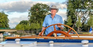 Derek Banks piloting hotel barge Anjodi on the Canal du Midi