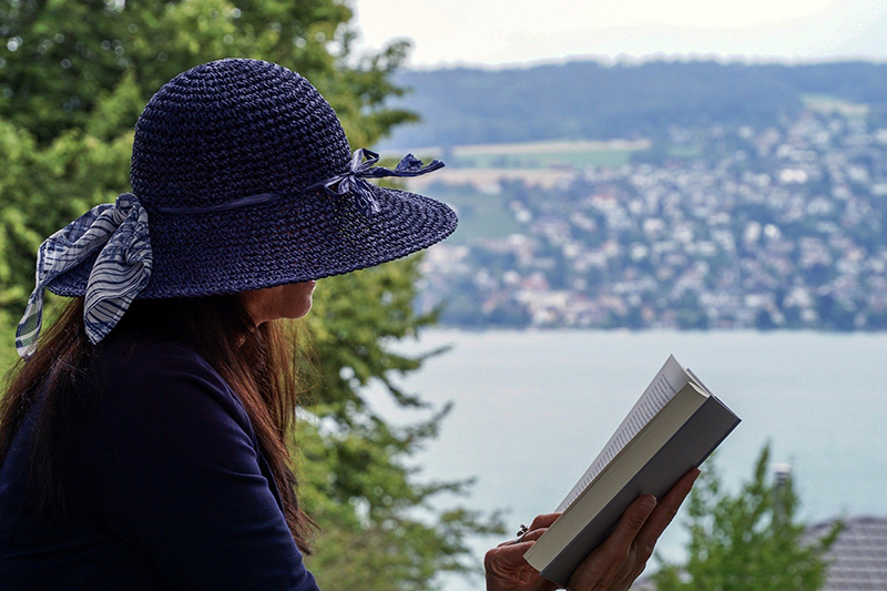 Holiday maker reading a book