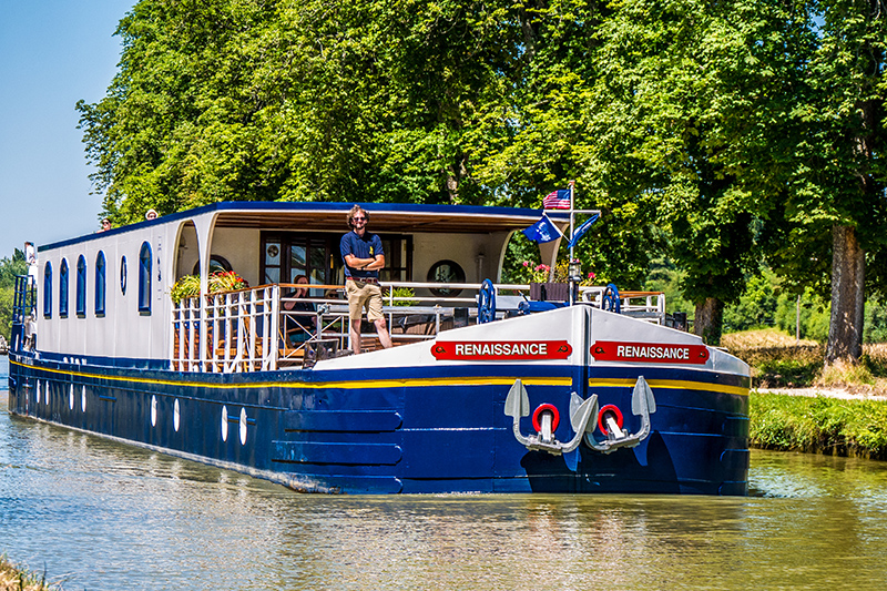 Captain and tour guide, Matthew aboard luxury hotel barge Renaissance