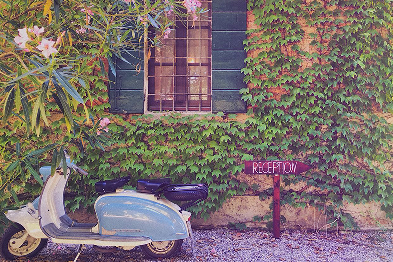 A Vespa parked outside Villa Ca'Zen, a highlight on our La Bella Vita cruise itinerary