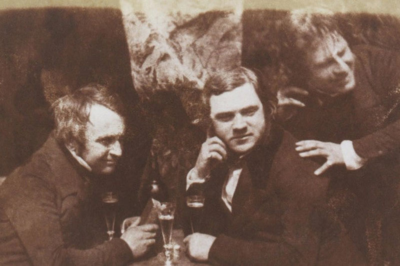 Scottish gentlemen enjoying a tipple in a tavern
