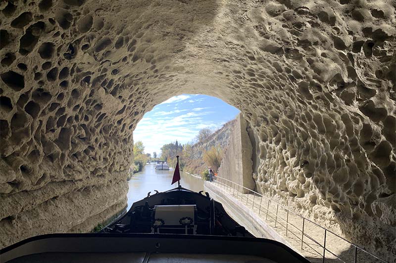 Anjodi cruising through the Malpas Tunnel on the Canal du Midi by Judi Cohen