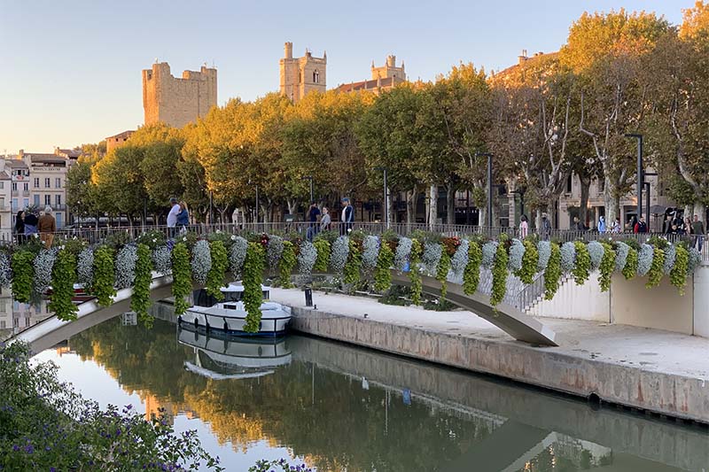 View of the cathedral over the canal in Narbonne by Judi Cohen