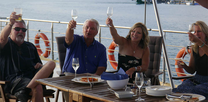 Guests aboard luxury hotel barge, La Bella Vita