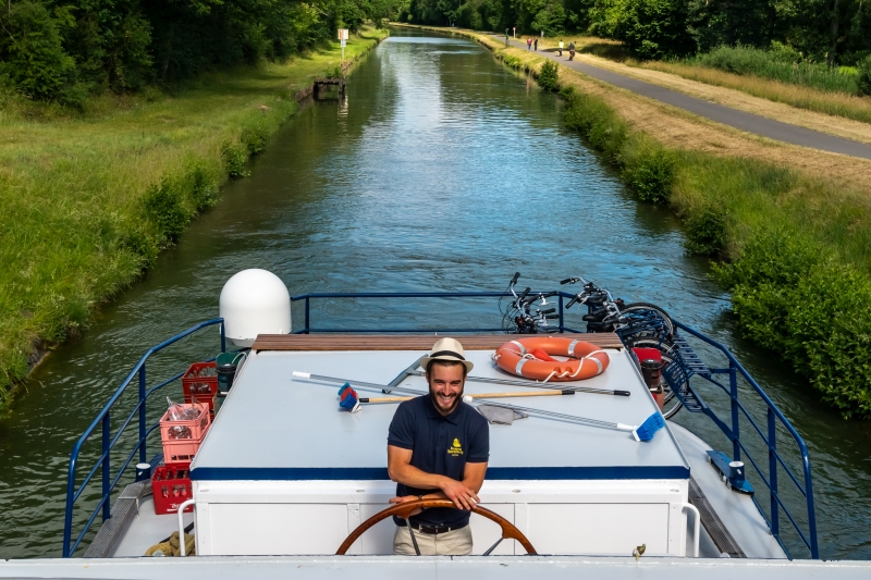 Captain Hadrian steers carefully into one of the many locks