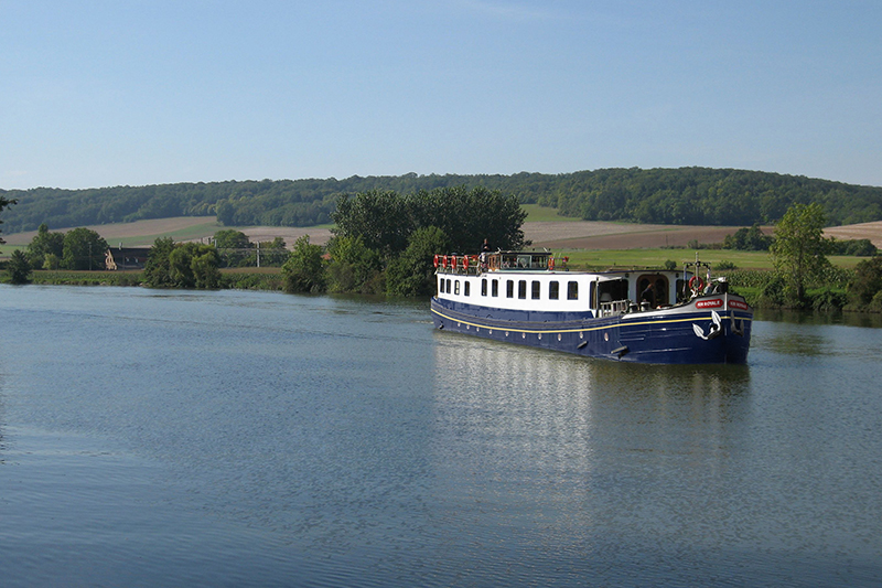 Luxury hotel barge Kir Royale cruising in Champagne