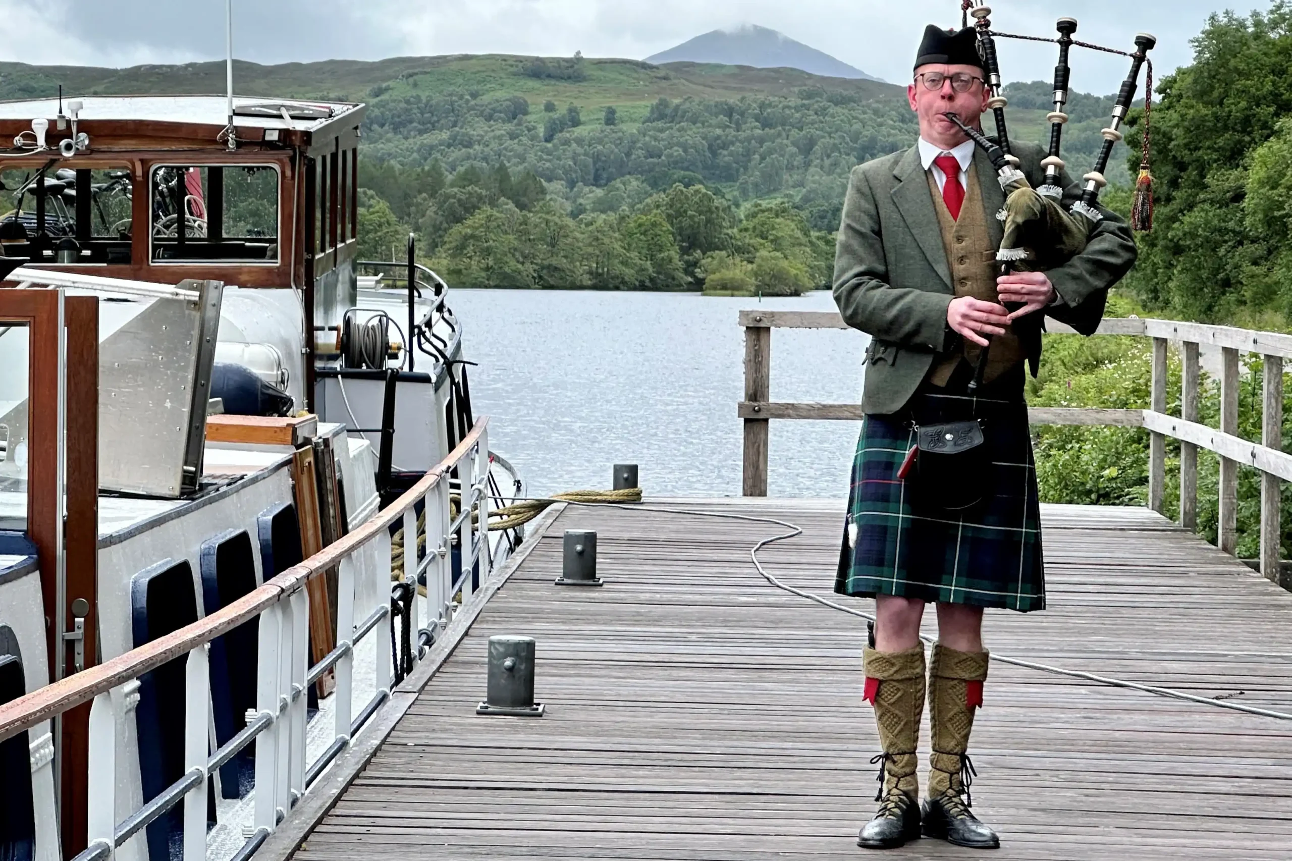 Bagpiper performing by the Scottish Highlander