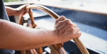 Captain at the helm aboard ART