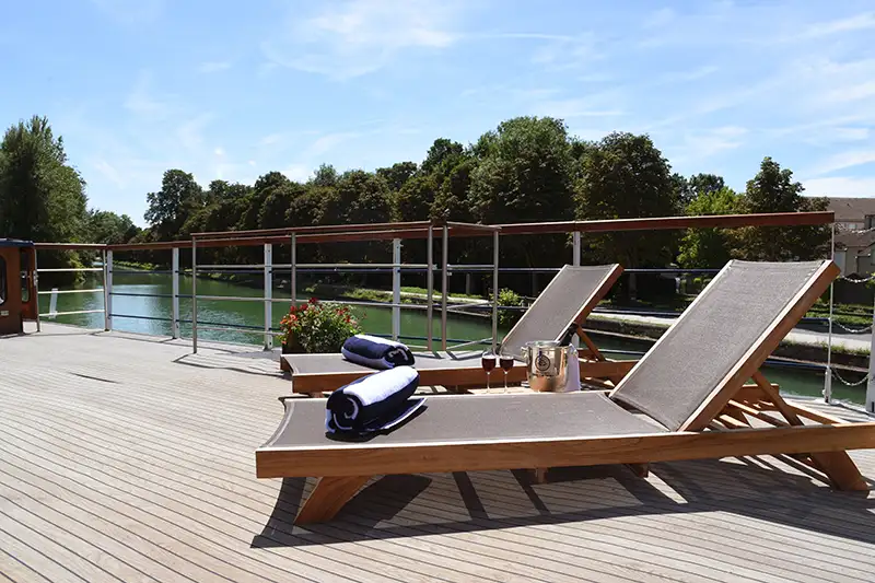 Sun loungers and fizz on deck aboard Kir Royale