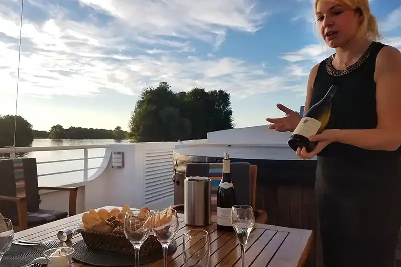 Host introducing wines Host introducing wines on board a European Waterways luxury barge cruise