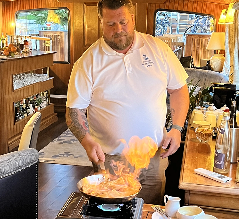 La Belle Epoque Captain, Craig Jenner, showing off his flambé skills La Belle Epoque Captain, Craig Jenner, showing off his flambé skills