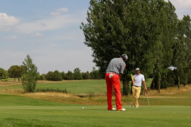 Two guys on the putting green