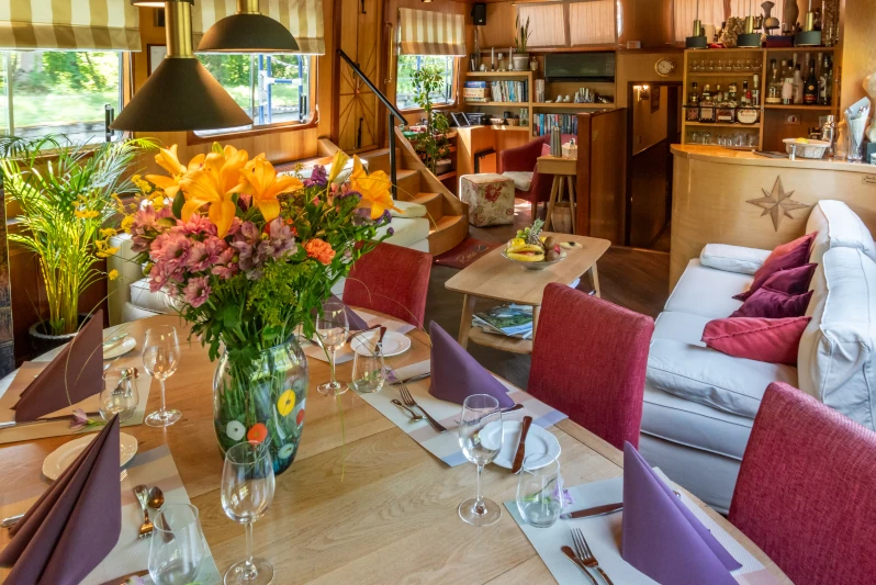 Onboard hotel barge Rosa in Gascony France by Rose Palmer interior salon and dining areas